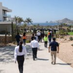 Emergency evacuation drill participants walking toward an assembly area in Los Cabos